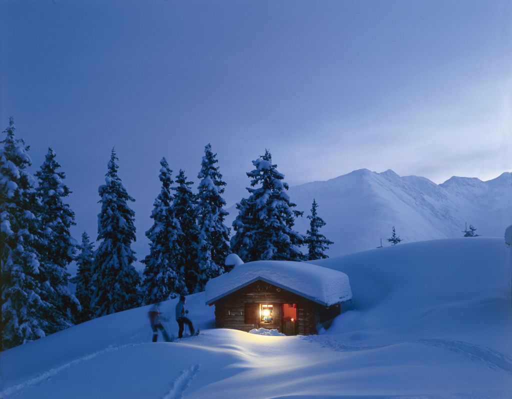 Switzerland. get natural. Evening after a snowshoe treck at Disentis, Canton Graubuenden. Schweiz. ganz natuerlich. Abends nach einer Schneeschuhtour bei Disentis, Kanton Graubuenden. Suisse. tout naturellement. Ambiance de crepuscule apres une randonnee en raquettes a neige a Disentis, canton des Grisons. Copyright by: Schweiz Tourismus By-Line: swiss-image.ch/Christof Sonderegger