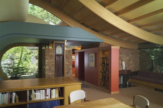 Again, with most of the furniture removed, this is a fine view which shows the interplay of the space with the exterior/outdoor view and feel. I suggest an evening shot so that the blue light can interplay with the warm tones and greens of the interior.