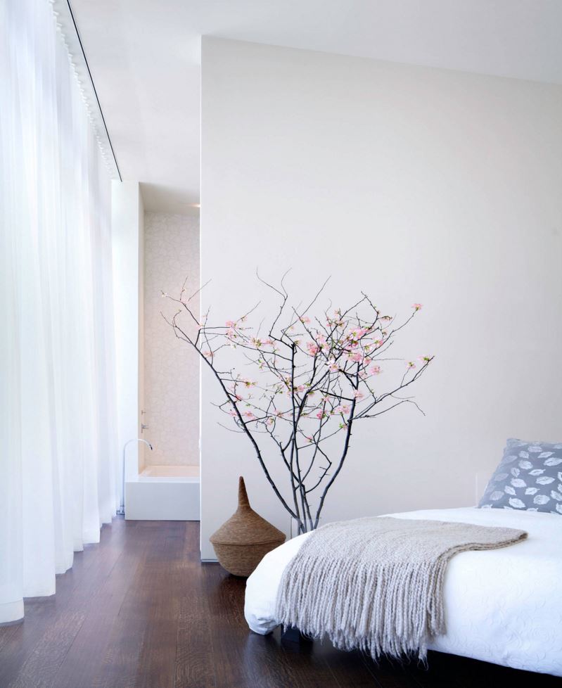 Cherry-blossom-branches-in-a-modern-bedroom