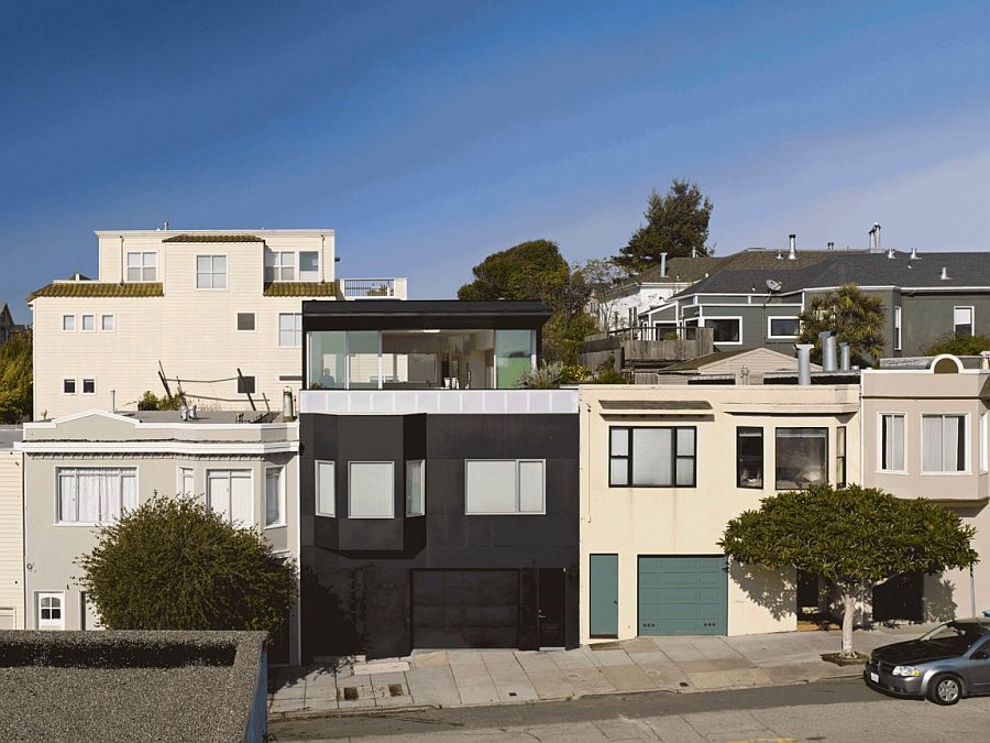 Matte-black-cladding-used-in-skateboard-ramps-shapes-the-homes-exterior