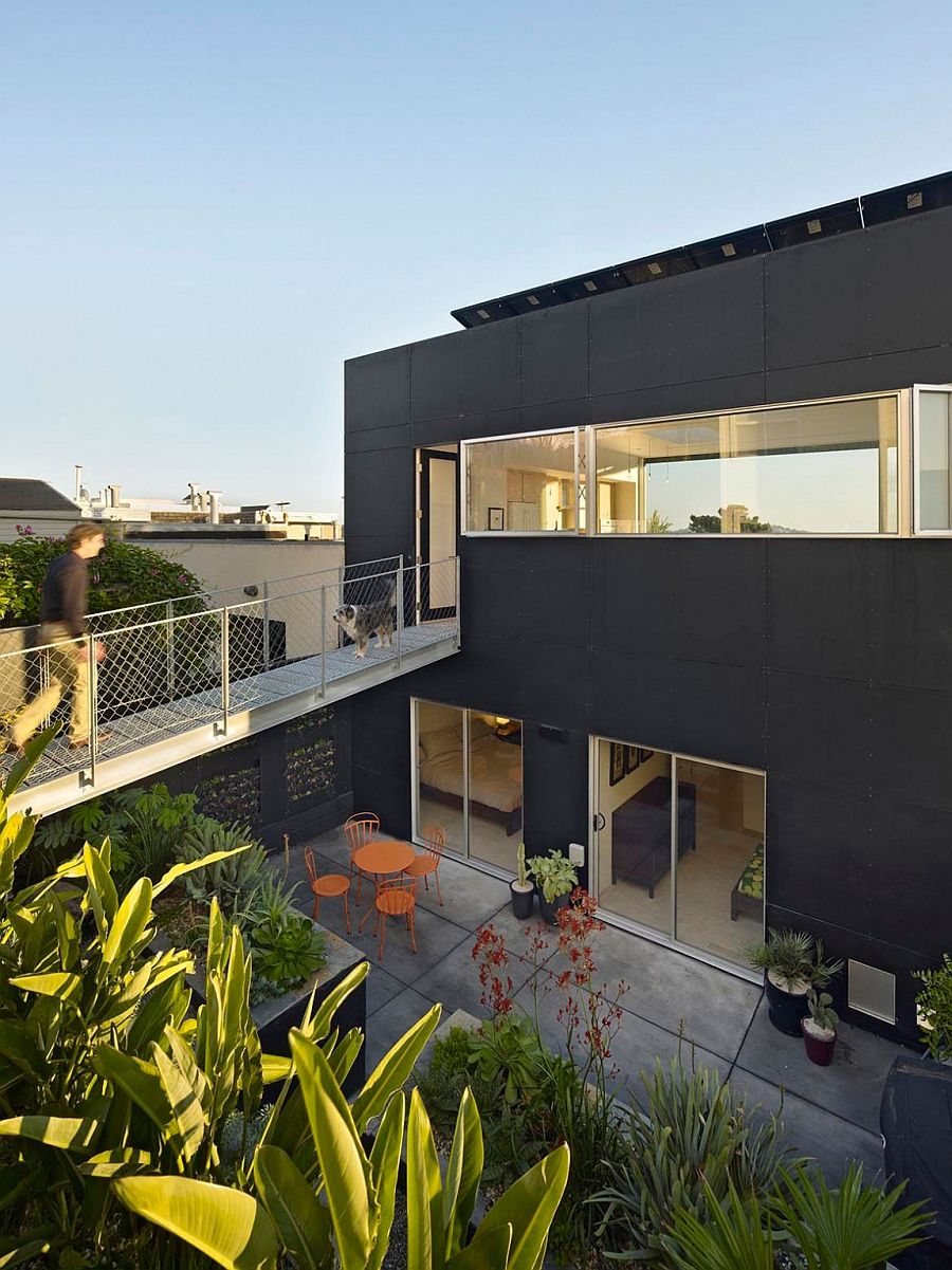 Steel-catwalk-connects-the-top-floor-directly-to-the-rear-garden