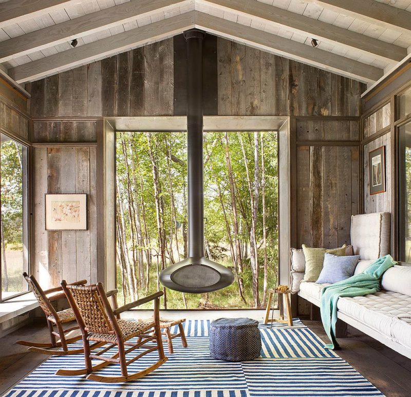 modern-fireplace-at-the-heart-of-rustic-sunroom