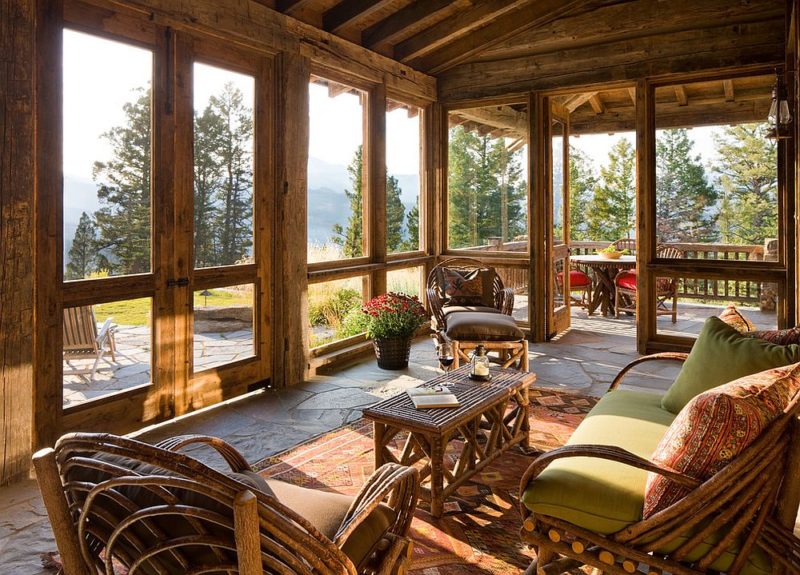 rustic-sunroom-that-flows-into-the-deck-acts-as-a-bridge-between-the-interior-and-the-outdoors