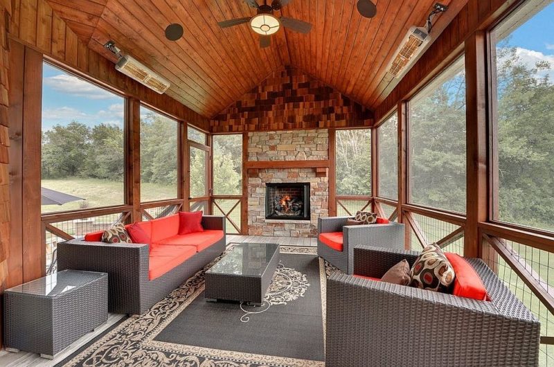 rustic-sunroom-with-a-splash-of-red-and-gray