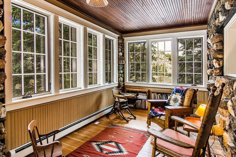 stone-and-beadboard-walls-bring-uniqueness-to-the-dashing-sunroom